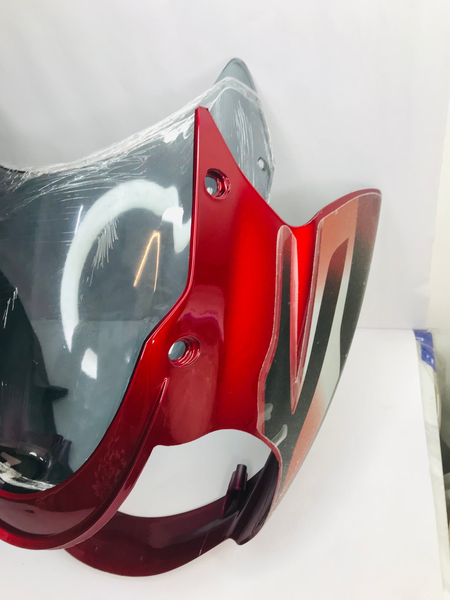 headlamp visor for bajaj discover 135 digital meter red in color with wind shiels